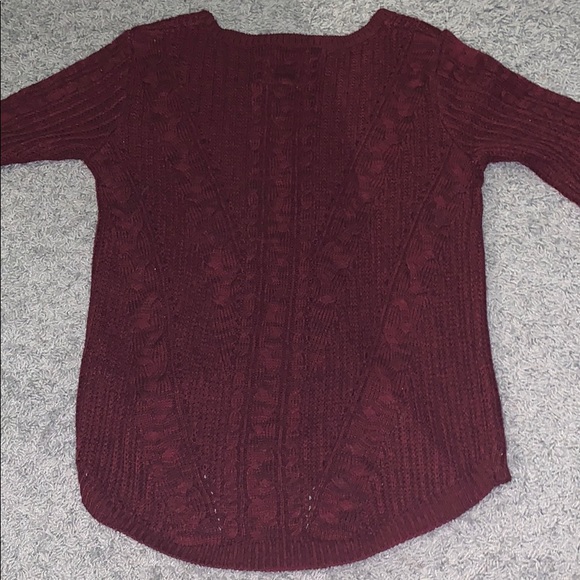 A a knitted sweater. - Picture 3 of 3